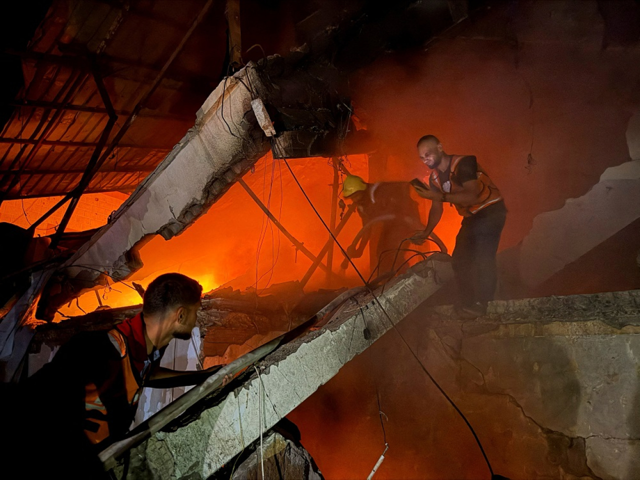 One Israeli air strike destroyed a house, killing a family of six, and started a huge fire. Photo: Reuters