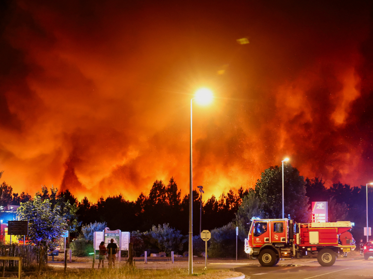 The Le Porge fire looms large for residents and firefighters from the Gironde department in France. Photo: Reuters