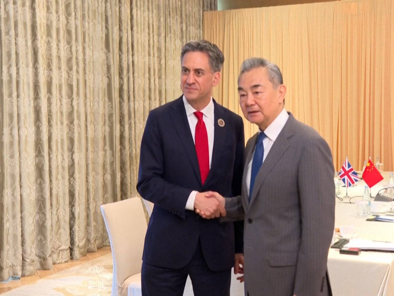 Wang Yi told Ed Miliband that China and the UK should work together to jointly uphold multilateralism in their talks in Manila. CCTV screengrab