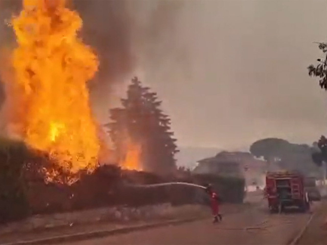 Firefighters battle a wildfire in San Mart&iacute;n de Valdeiglesias, Madrid. Screengrab from Spain's Military Emergencies Unit UME via AFP