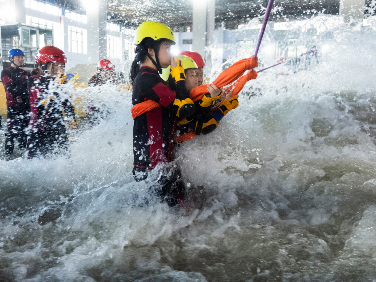Residents in Hangzhou are put through a flash flood simulator as part of a typhoon survival training session. File photo: Reuters