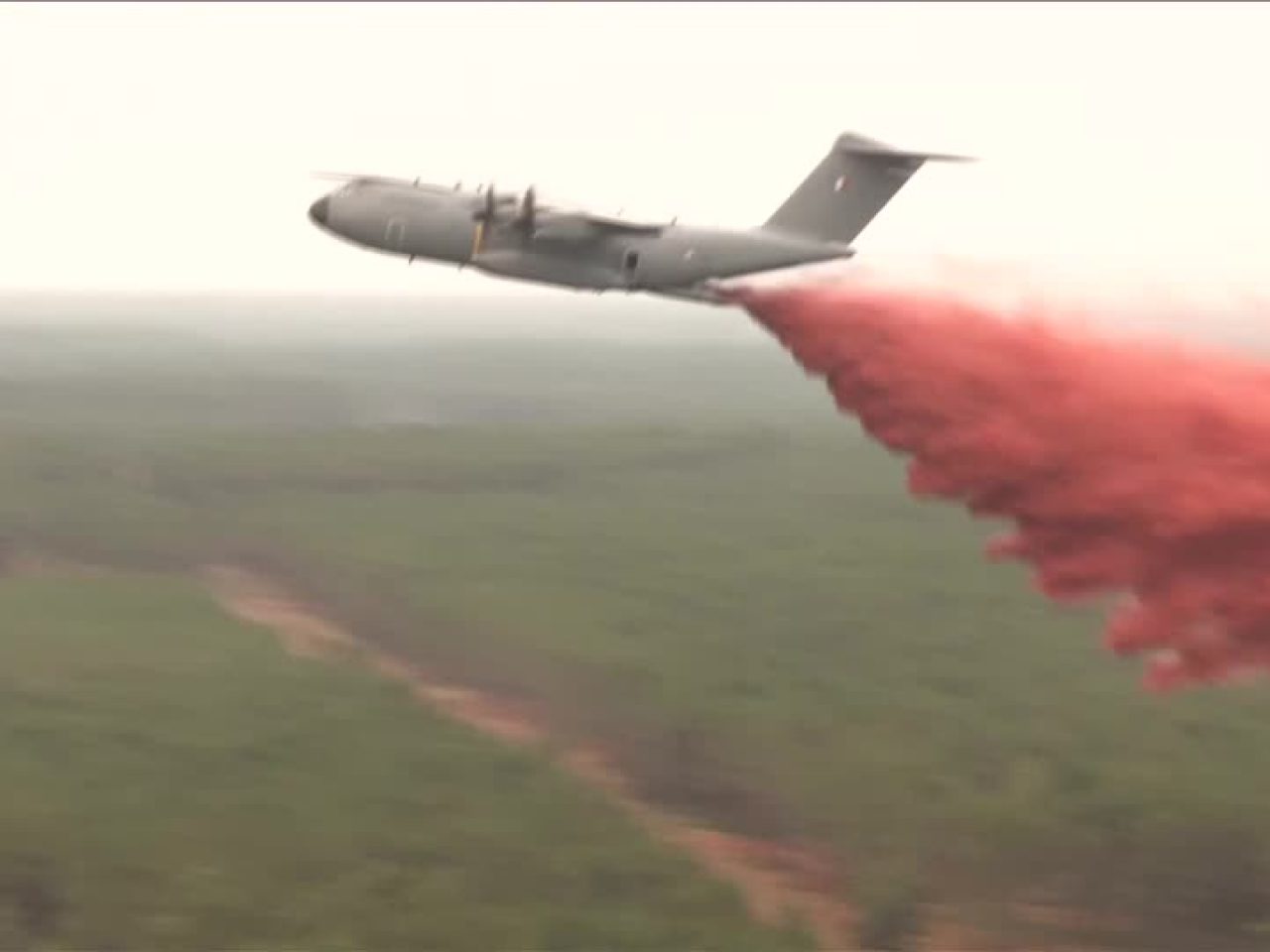 An A400M military transport aircraft dumps a retardant over a fire-hit forest in Lacanau, France. Photo: Reuters