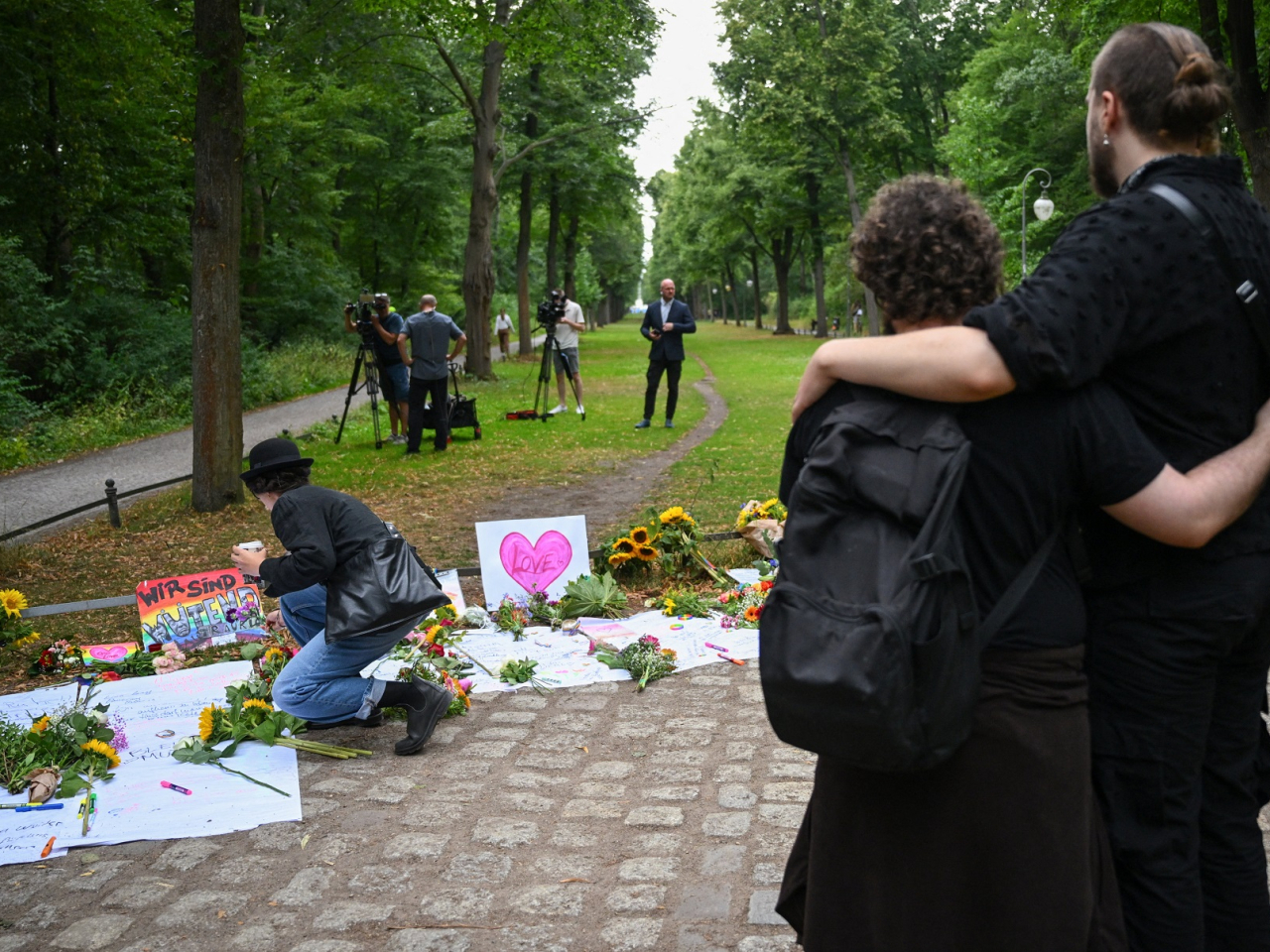 People pay tributes at Tiergarten park in Berlin in the wake of the deadly attack not far from a Pride celebration. Photo: Reuters
