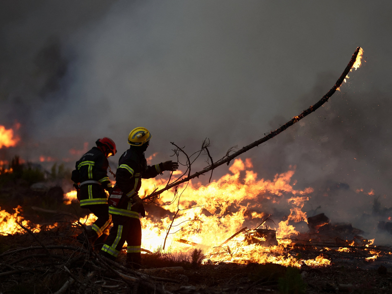 Firefighters battle the flames in Gironde, France. Photo: Reuters