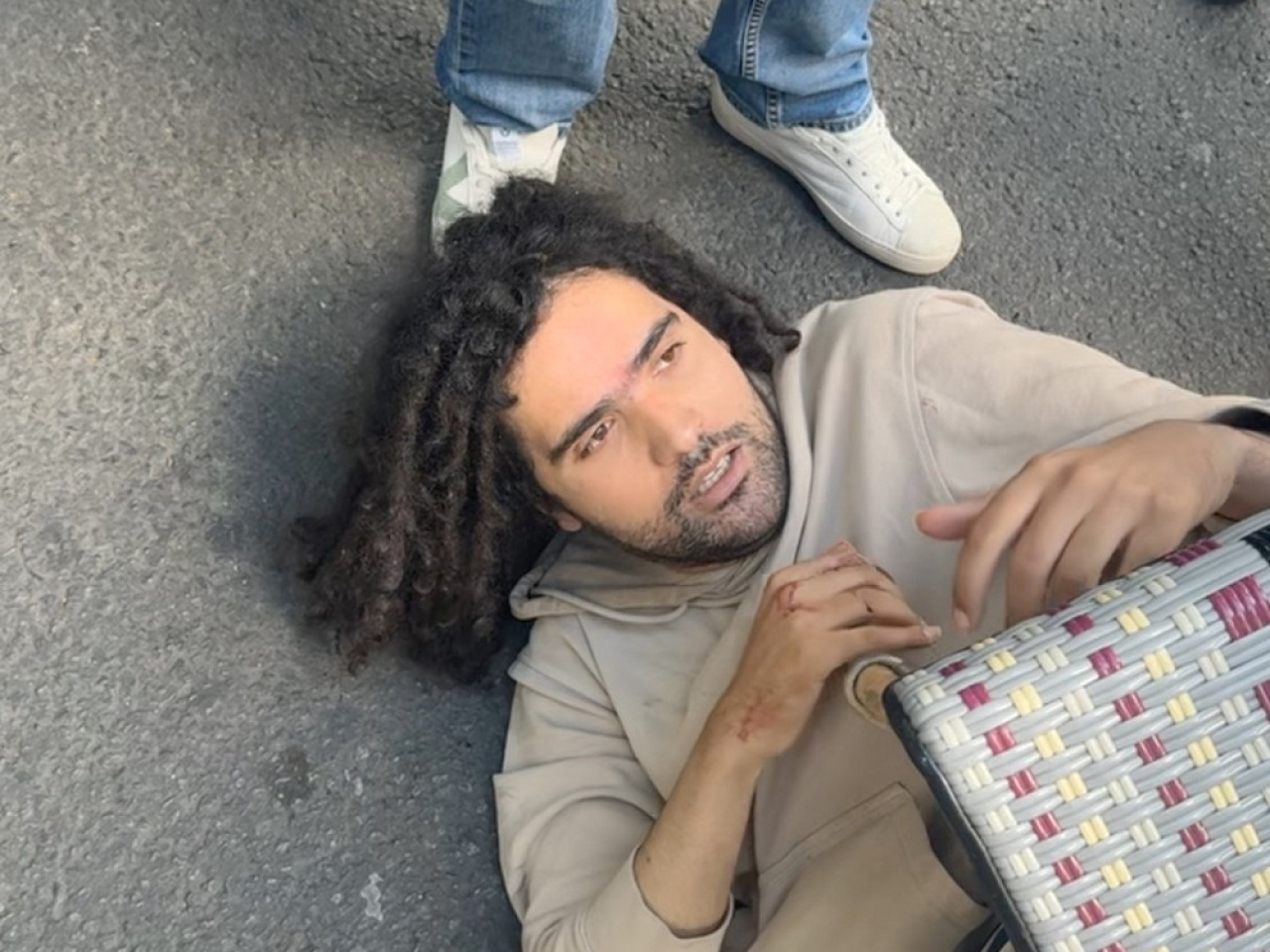 A passerby used a small suitcase to knock the knife attacker to the ground before pinning him there as help arrived. Photo: Reuters