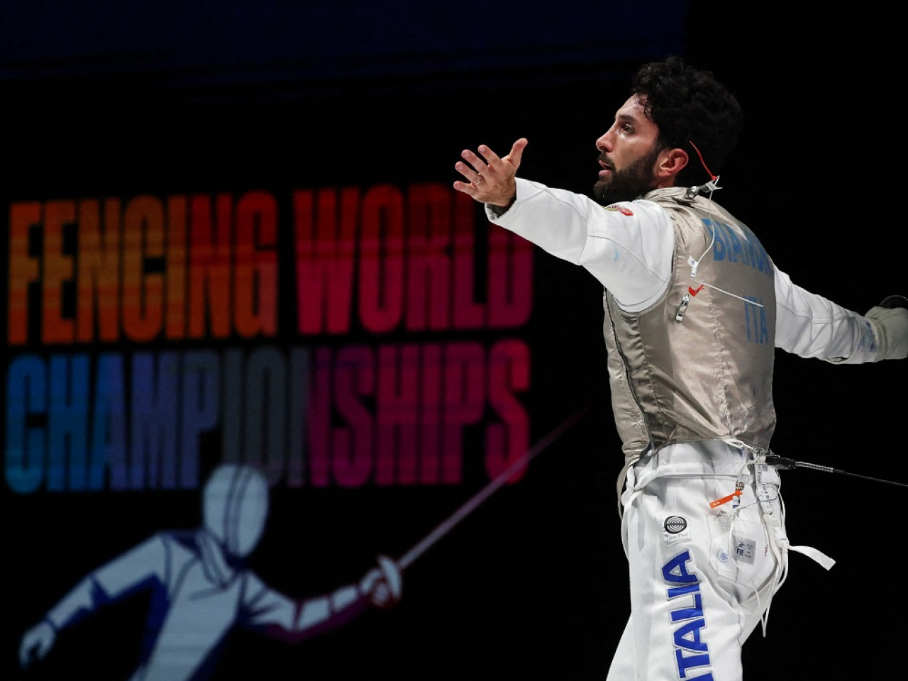 Guillaume Bianchi celebrates after defeating Ryan Choi to win gold for Italy. Photo: Reuters