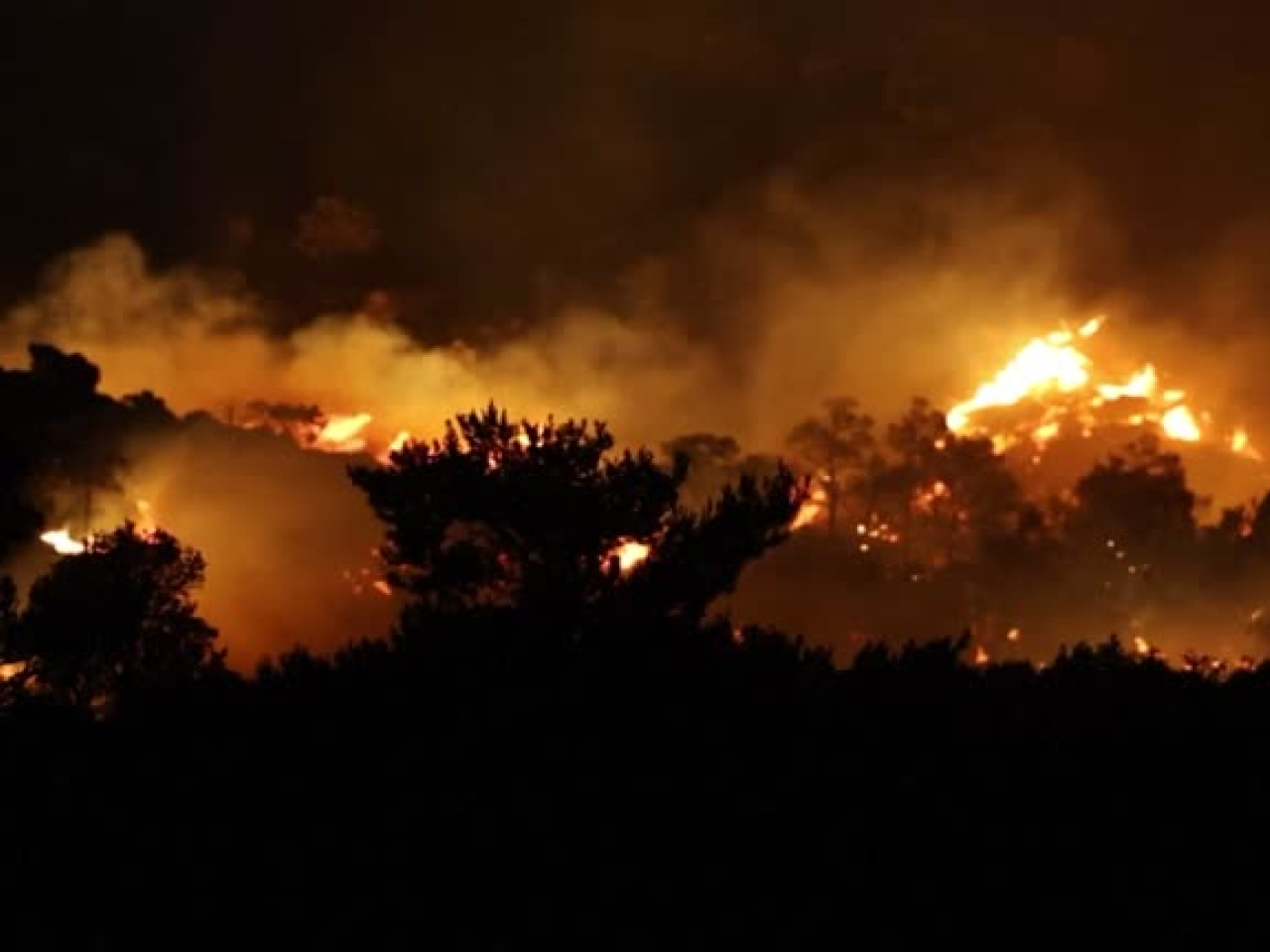 Two of the men had been trapped by the blaze in their fire engine in the foothills of a mountain near the western city of Rethymno. File photo: Reuters