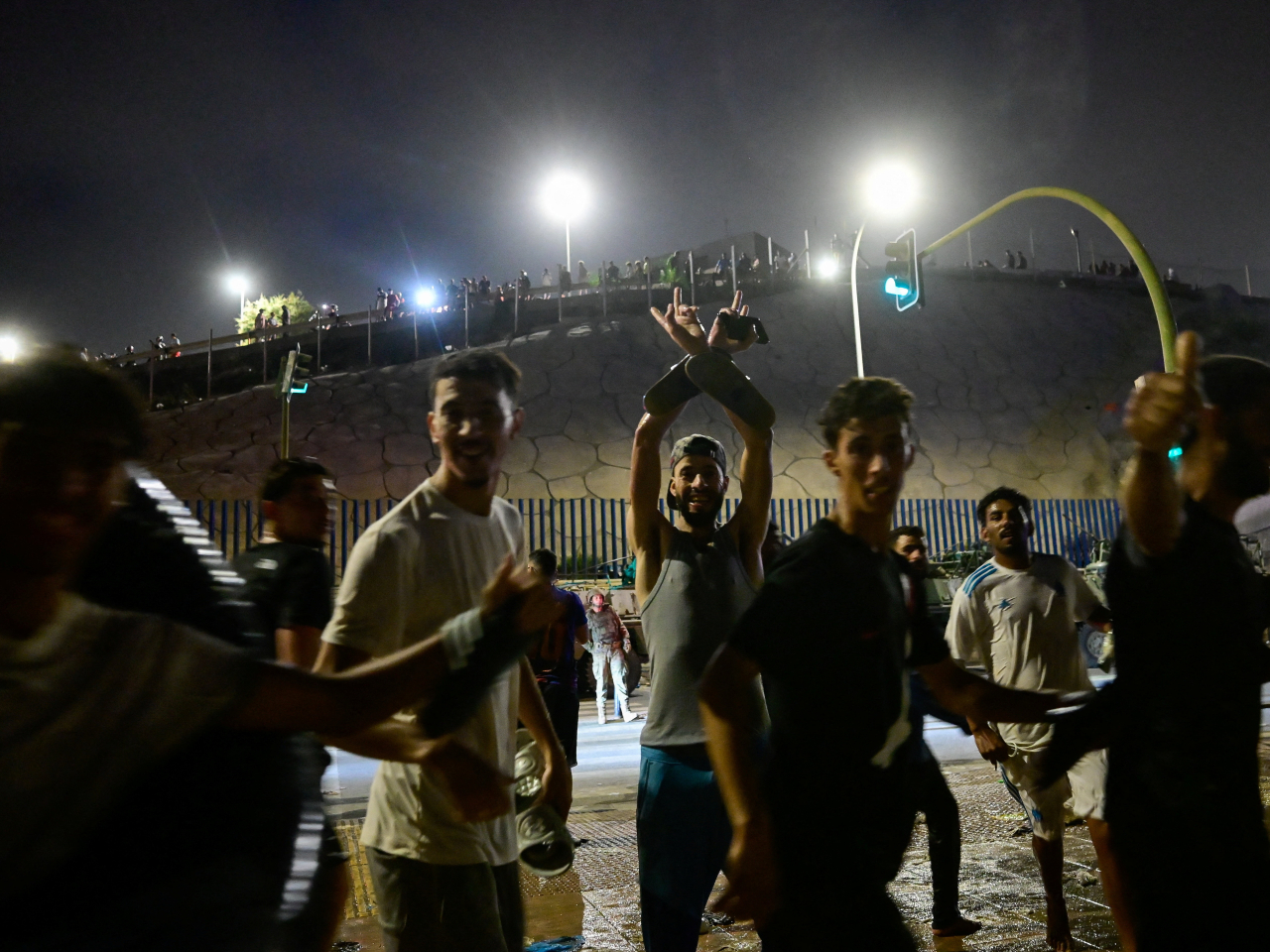 Migrants from Morocco celebrate after crossing into the Spanish enclave of Ceuta. Photo: Reuters