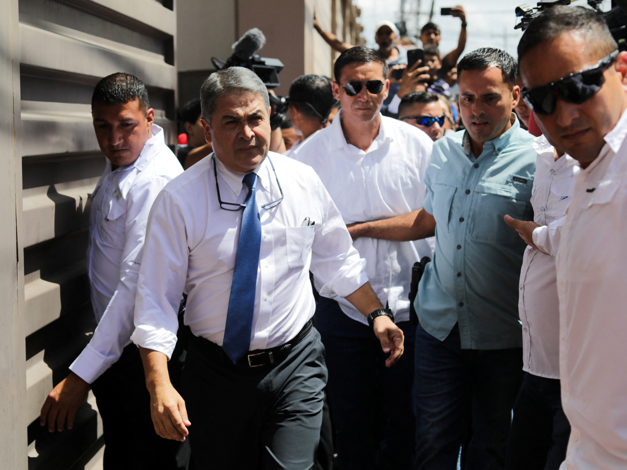 Former Honduran President Juan Orlando Hernandez leaves the Supreme Court in Tegucigalpa. Photo: Reuters