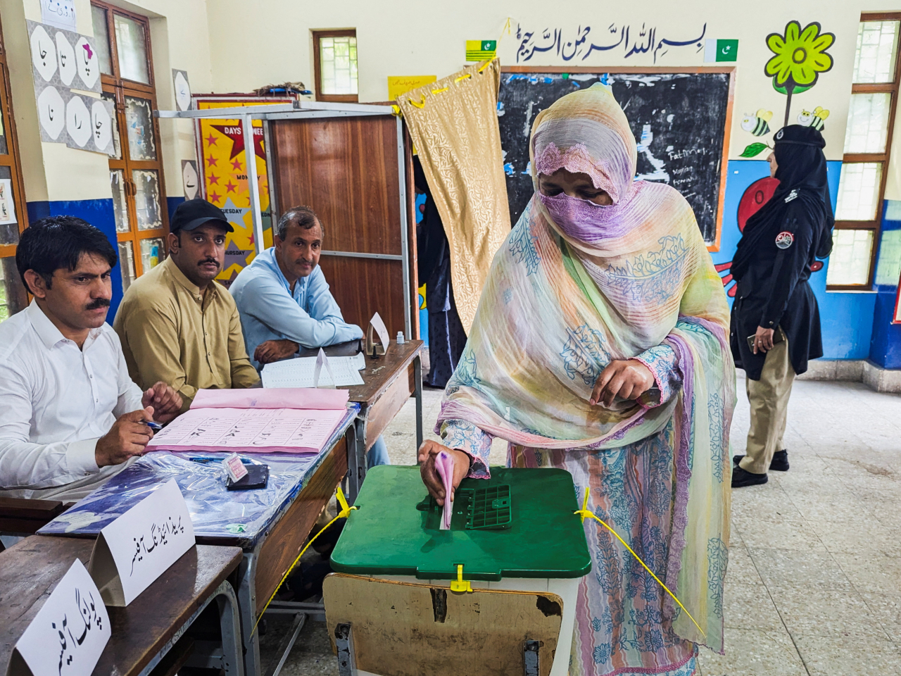 A woman votes during the second phase of the Azad Jammu and Kashmir elections in Muzaffarabad, Pakistan. File Photo: Reuters