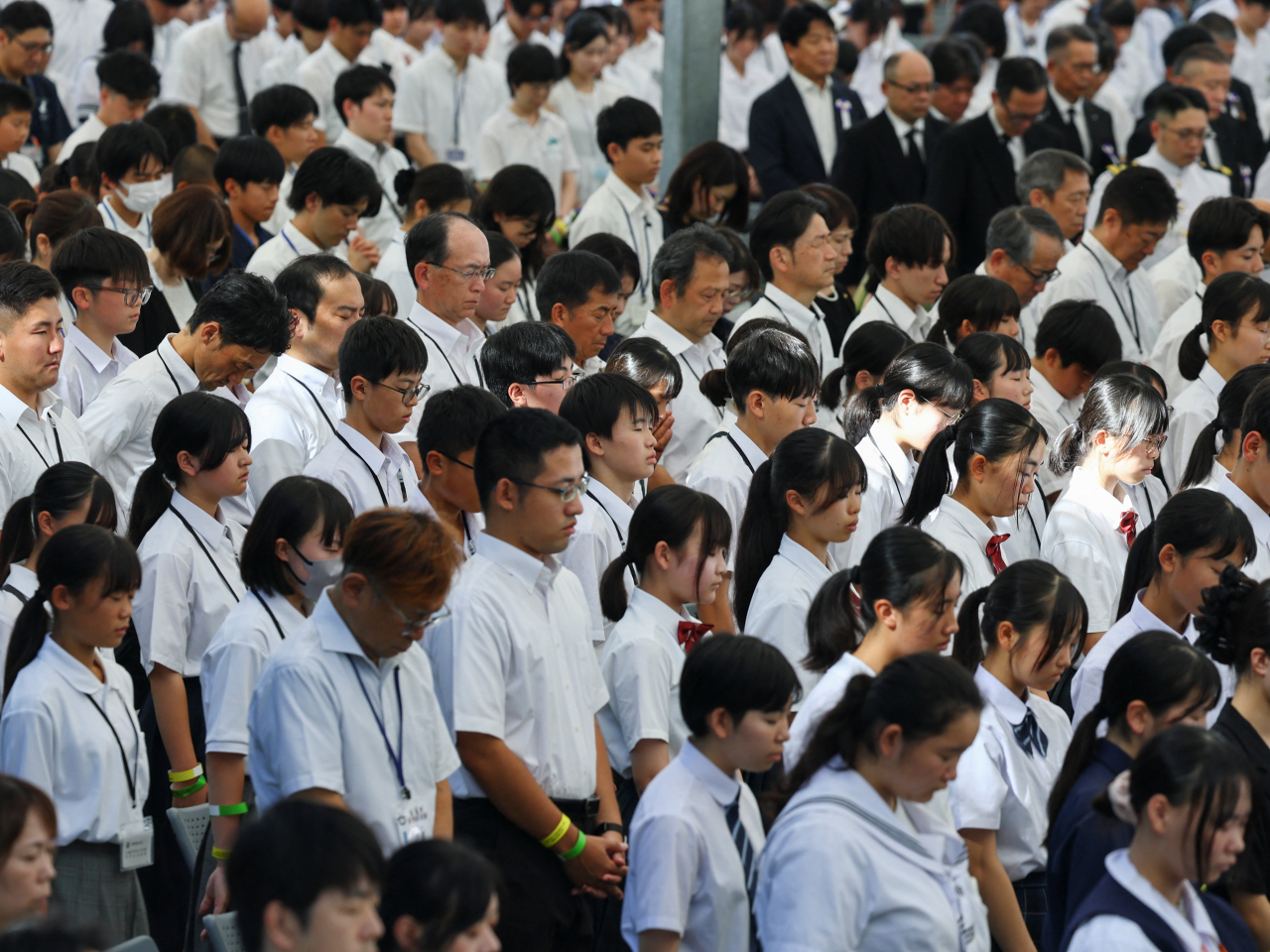 People pay silent tribute during the 81st anniversary of the atomic bombing at Hiroshima Peace Memorial Park. Photo: Reuters