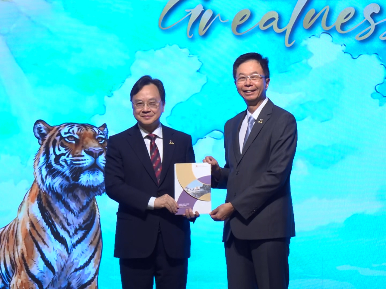 Dennis Lo (left) says CUHK's five-year plan shows its determination to continuously improve. Photo: RTHK