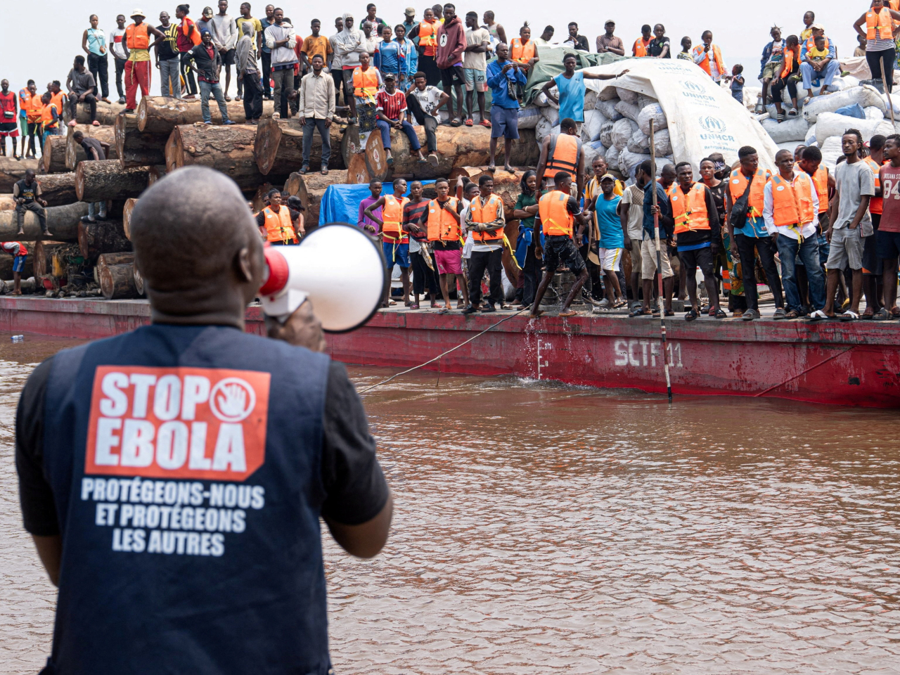 A boat heading towards Kinshasa is intercepted amid reports a passenger had died of Ebola. Photo: International Organisation for Migration via Reuters