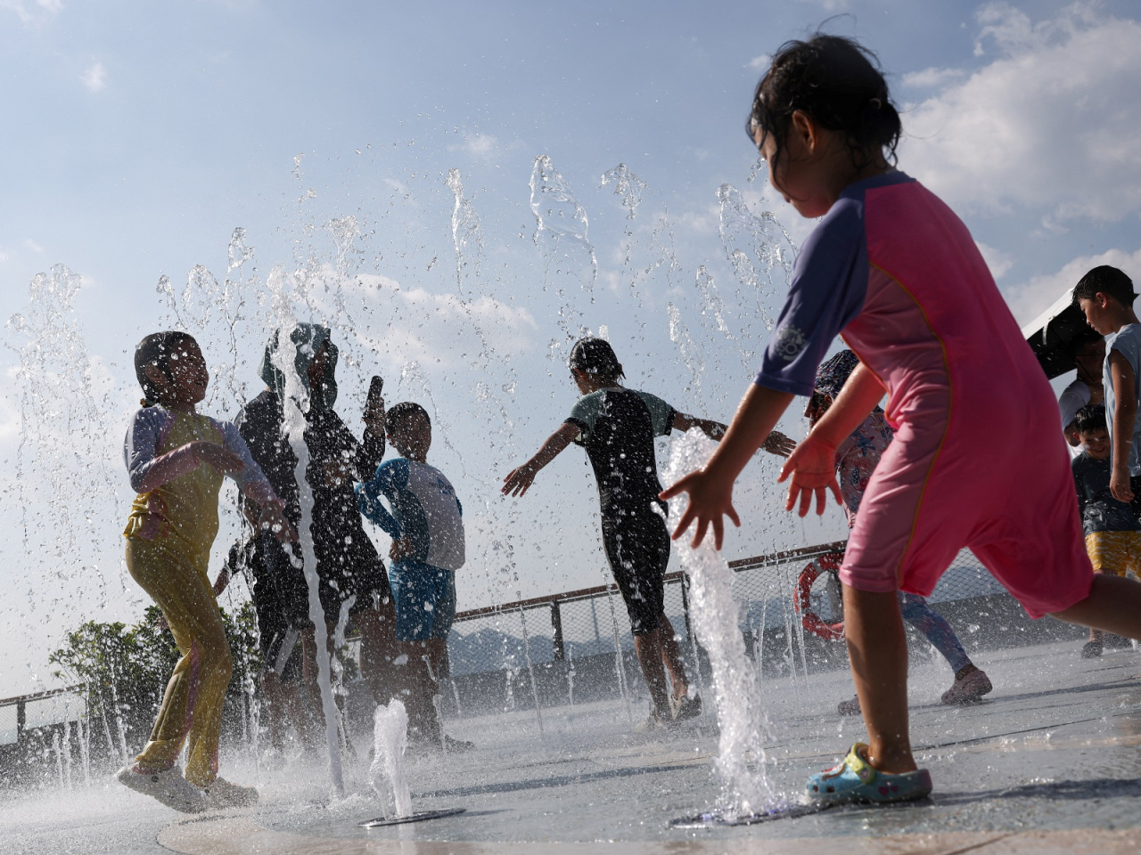 The Labour Department said it would review whether further optimisation is needed for its Heat Stress at Work Warning, as a heatwave breaks records in Hong Kong. Photo: Reuters