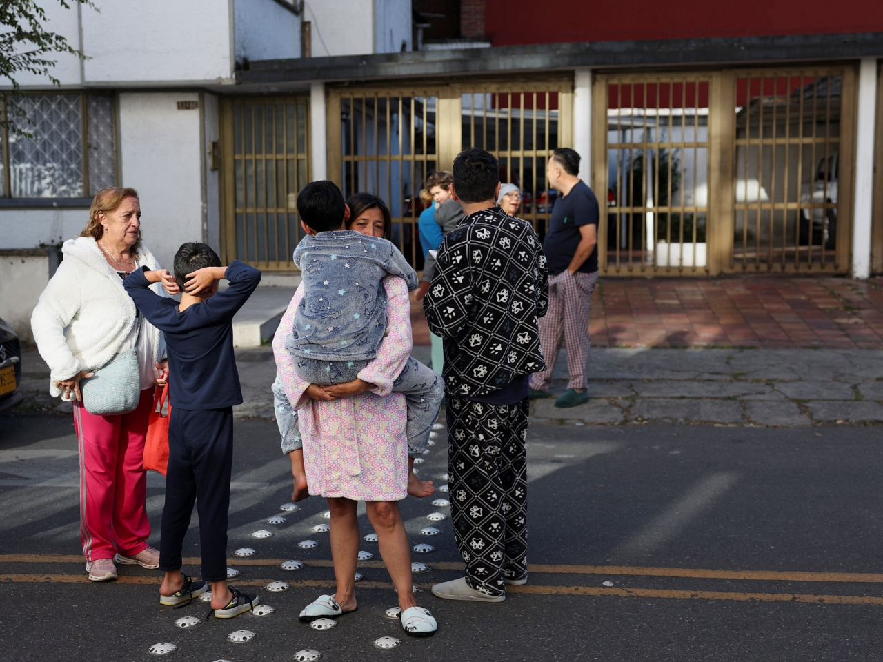 Some Bogota residents gather outside their building after the quake. Photo: Reuters