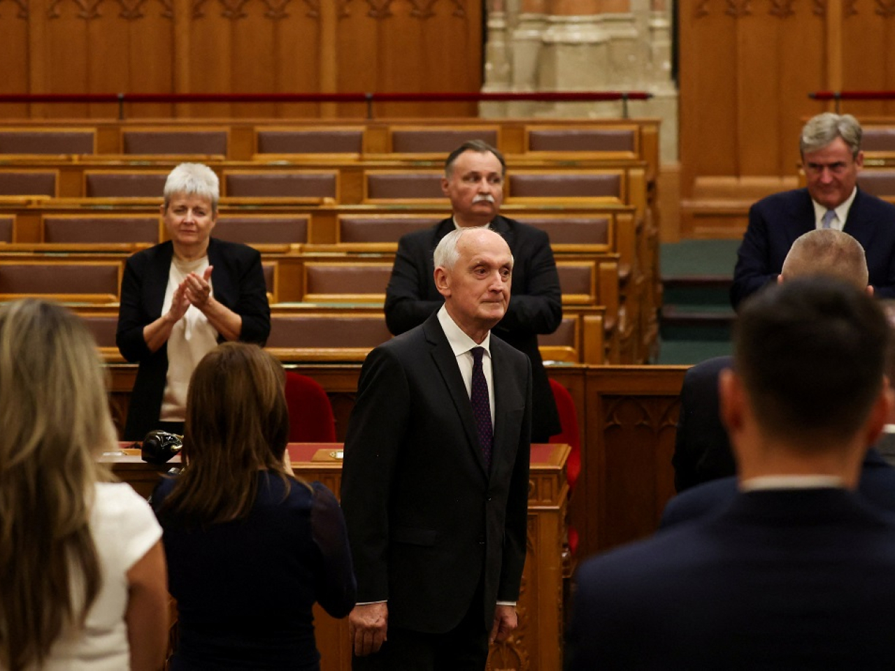 Andras Baka is applauded by MPs after taking his oath of office. Photo: Reuters
