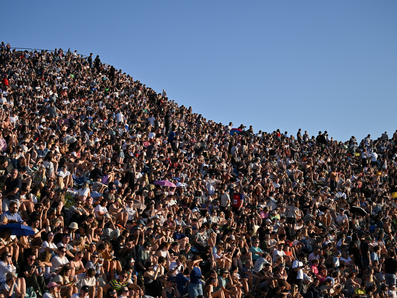 A large crowd watches the solar eclipse at Olympic Park in Munich, Germany. Photo: Reuters