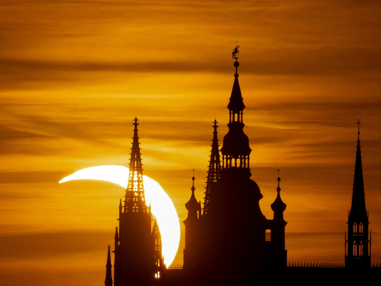 People in Prague were treated to a partial eclipse over the Prague Castle. Photo: Reuters