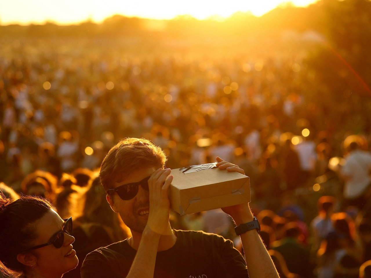 People used protective glasses and other devices to protect their eyes from the sun as they viewed the celestial event at Tempelhofer Feld in Berlin. Photo: Reuters