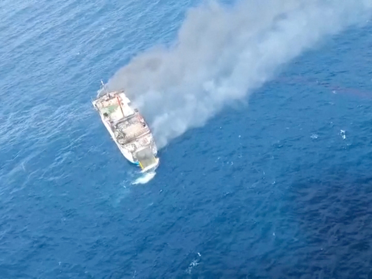 An aerial view shows thick smoke rising from Putri Yasmin ferry in waters off Lombok, Indonesia. Photo: Basarnas via Reuters