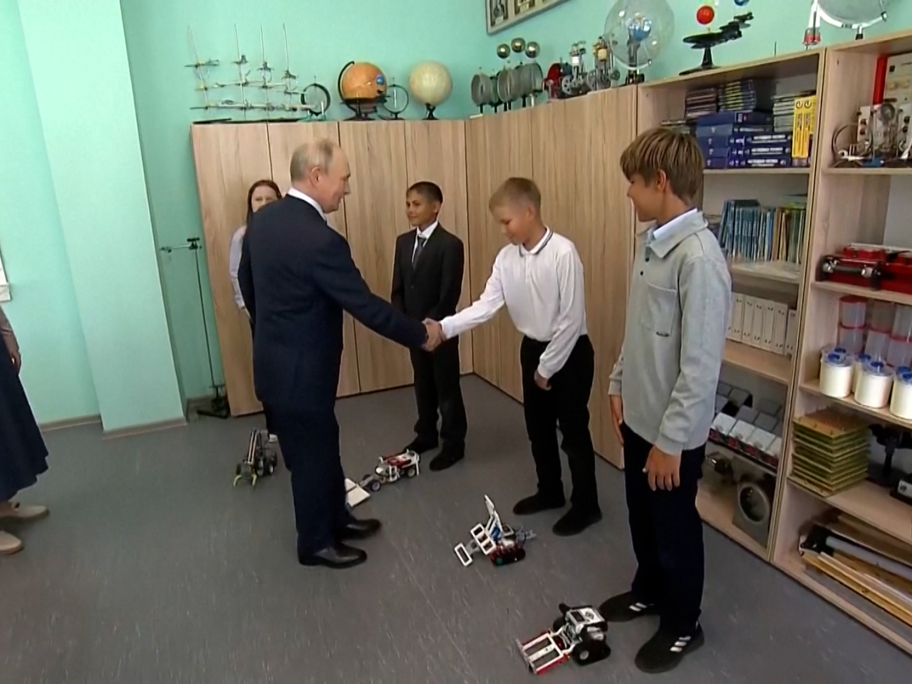 Vladimir Putin meets with youngsters on the island known as Iturup in Russia and Etorofu in Japan. Reuters screengrab