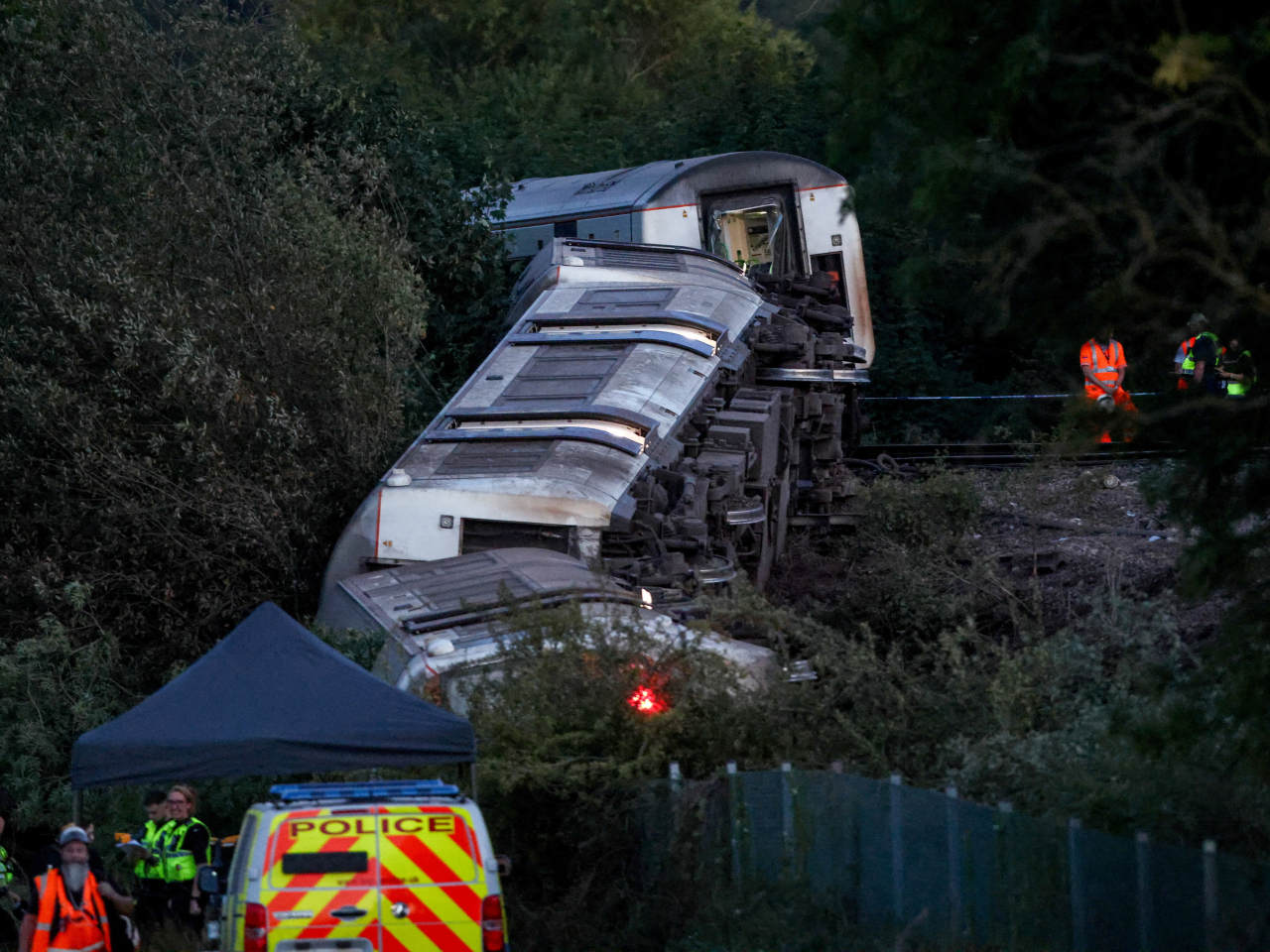 Emergency personnel are at the scene of an overturned train that derailed near Lewes in southern England. Photo: Reuters