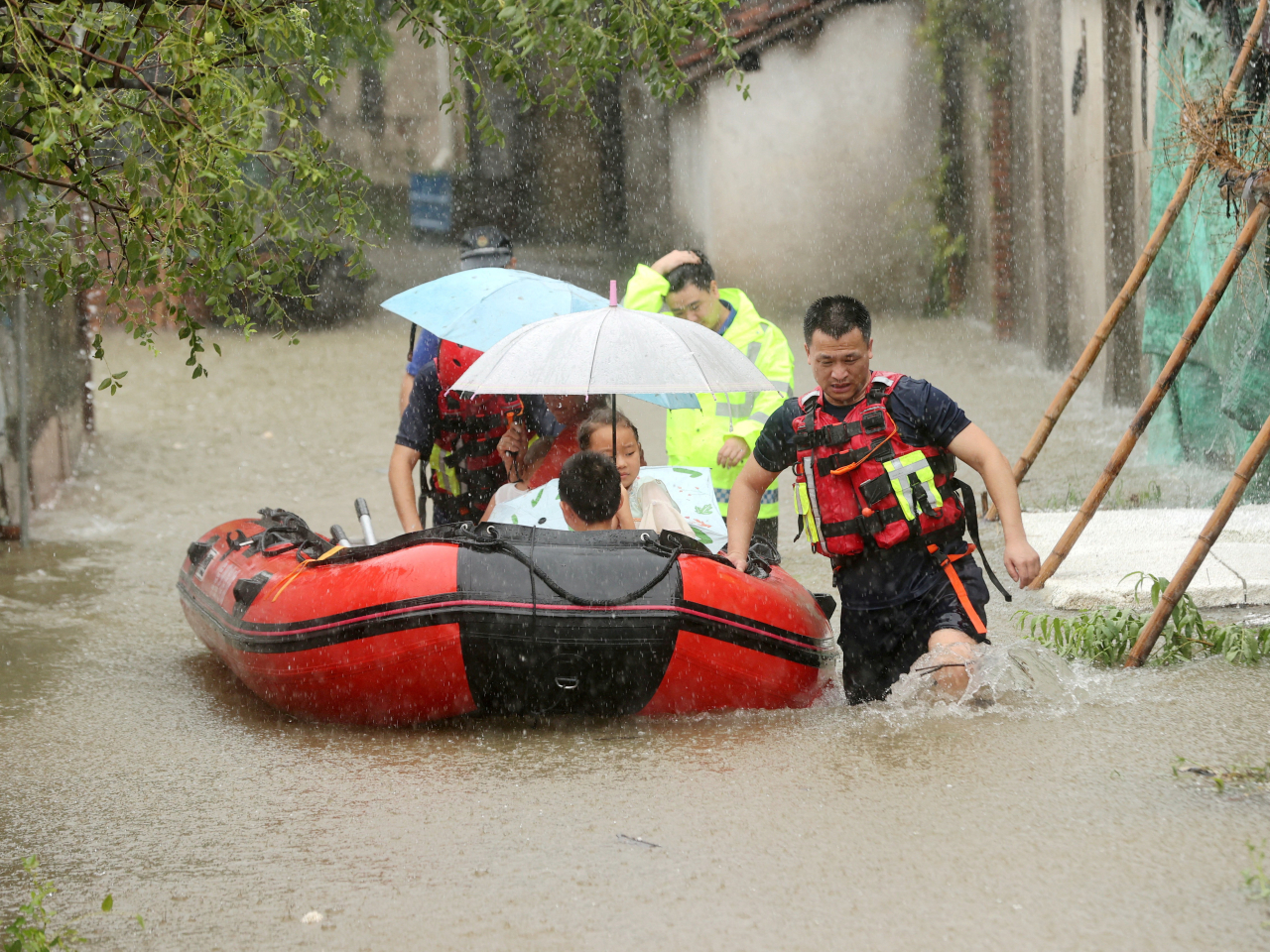 Villagers are evacuated following heavy rainfall brought by remnants of Typhoon Dolphin in Huzhou, Zhejiang. Photo: China Daily via Reuters