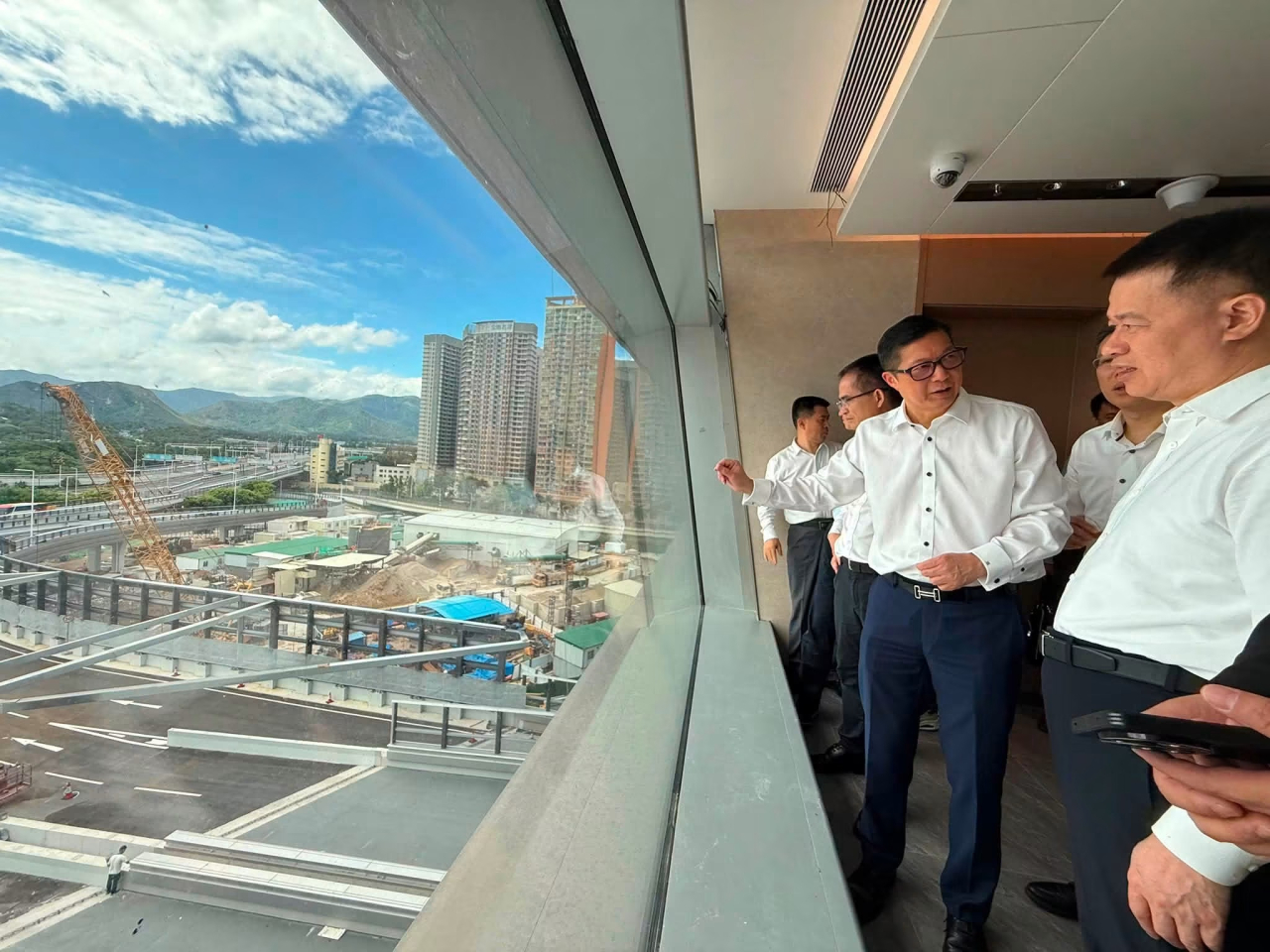 Chris Tang and Shenzhen leaders review final preparations at the new Huanggang crossing. Photo courtesy of Chris Tang's Facebook page.