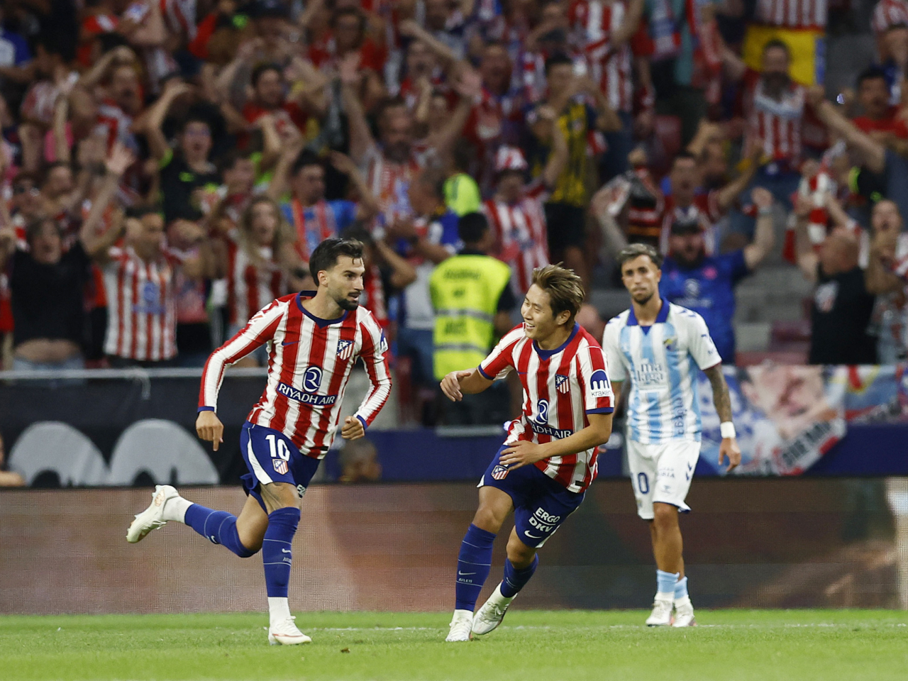 Alex Baena, left, sealed Atletico's 2-0 win with a late second-half strike. Photo: Reuters