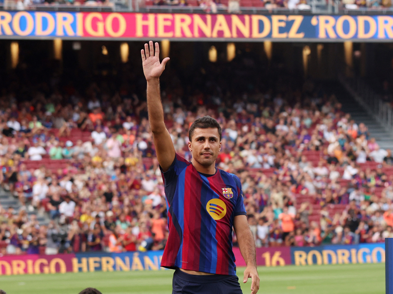 Rodri is introduced in front of home fans before a pre-season friendly between FC Barcelona v Al Ahly on August 19. Photo: Reuters