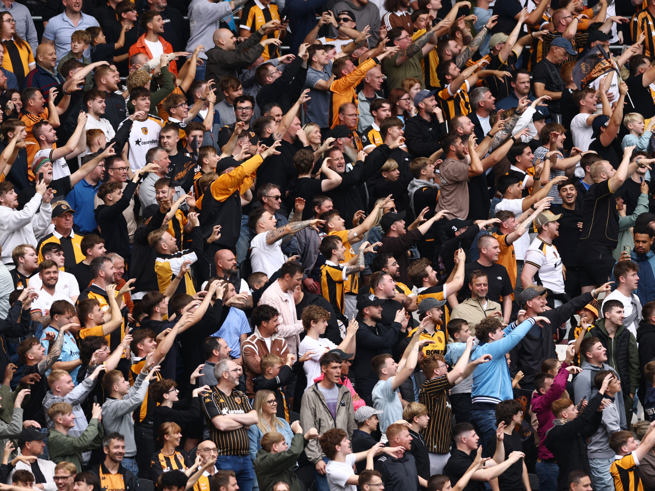Hull City fans celebrate their side's season-opening win over Manchester United, ending a nine-year absence from the English top flight. Photo: Reuters