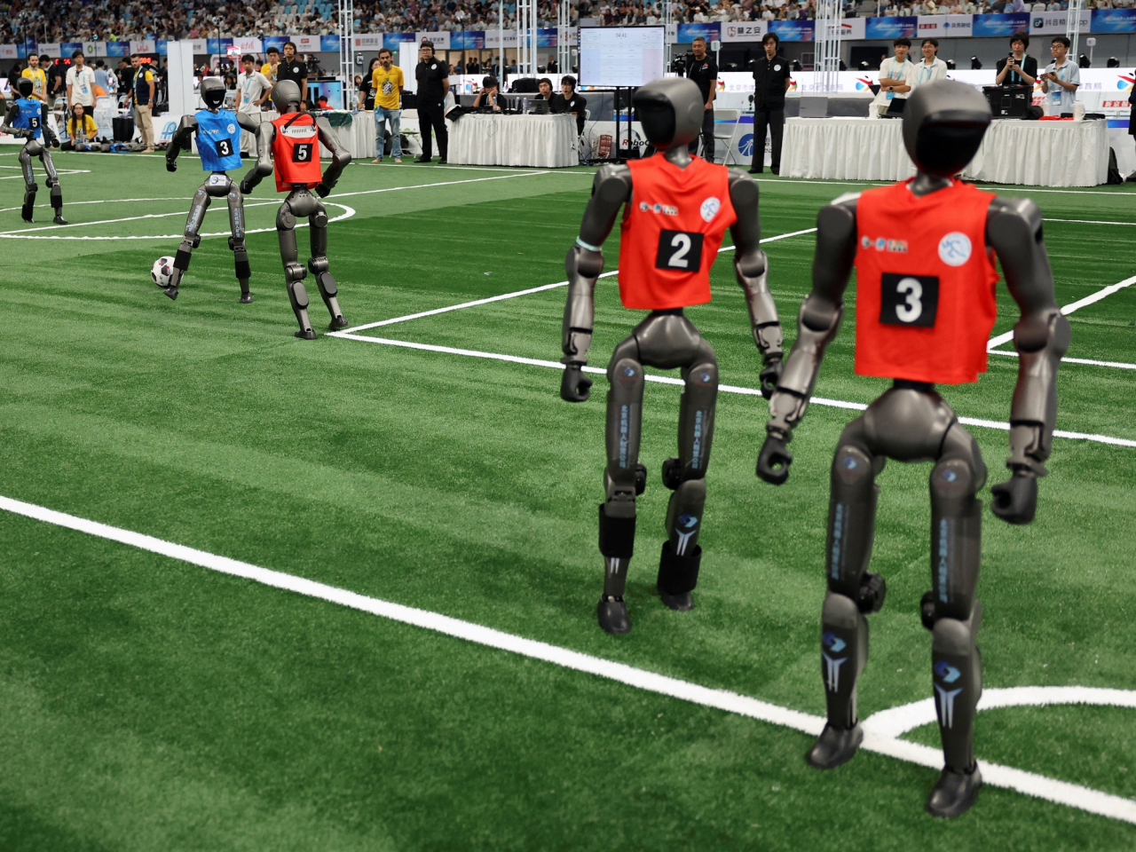 Humanoid robot football players take to the field in Beijing. Photo: Reuters