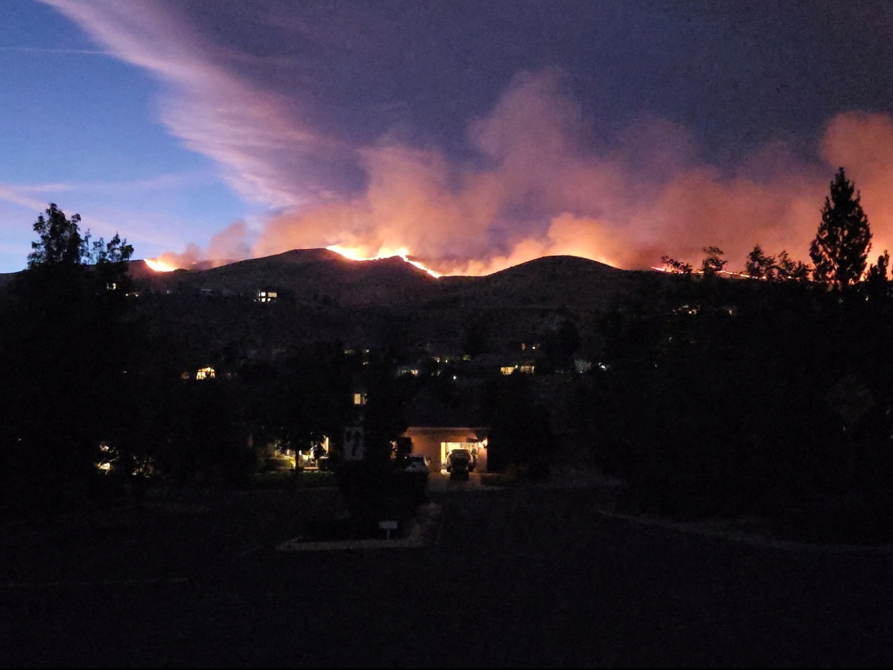 A screengrab from social media video shows smoke rising from the fire in in Reno, Nevada. Image: @SquintDev via Reuters