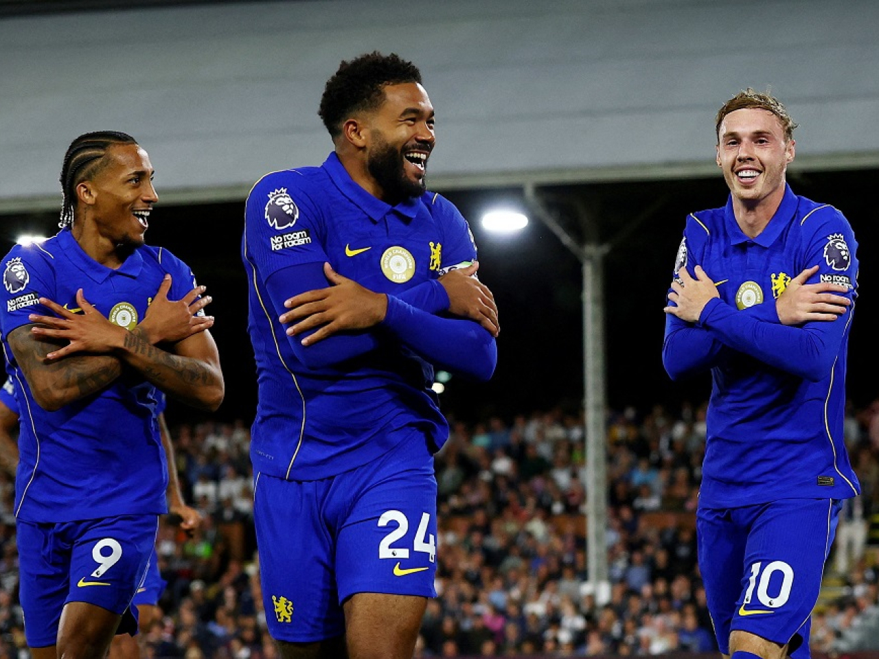 It was chaos at the Cottage, but a cool finish from Cole Palmer (right) bagged Chelsea the points. Photo: Reuters