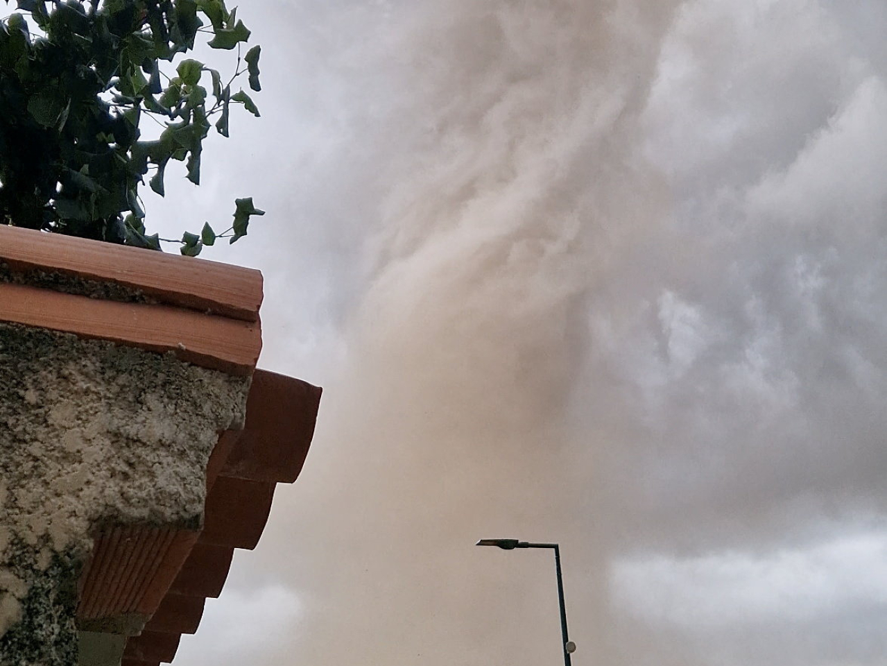 This screengrab from a social media video shows a large tornado moving through Verzeille in southern France. Image: Denis Marechal via Reuters