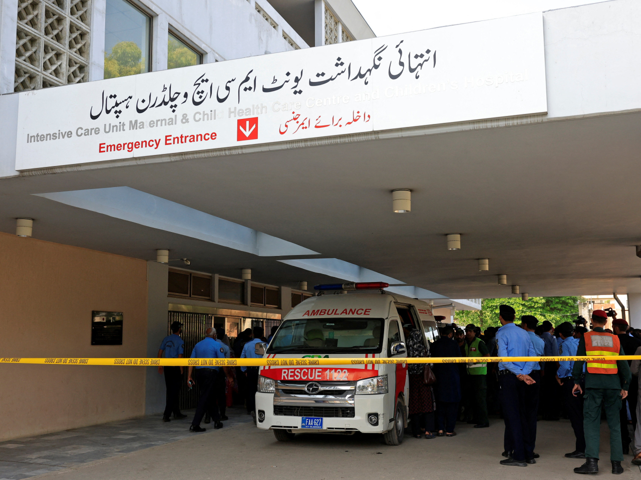 Police officers move past an ambulance outside an intensive care unit after a fire broke out at the Pakistan Institute of Medical Sciences (PIMS) hospital in Islamabad. Photo: Reuters