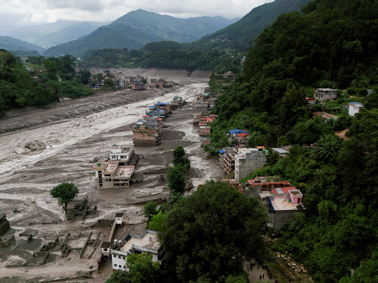 Properties are covered in mud after a flash flood in the Nuwakot district, Nepal. Photo: Reuters