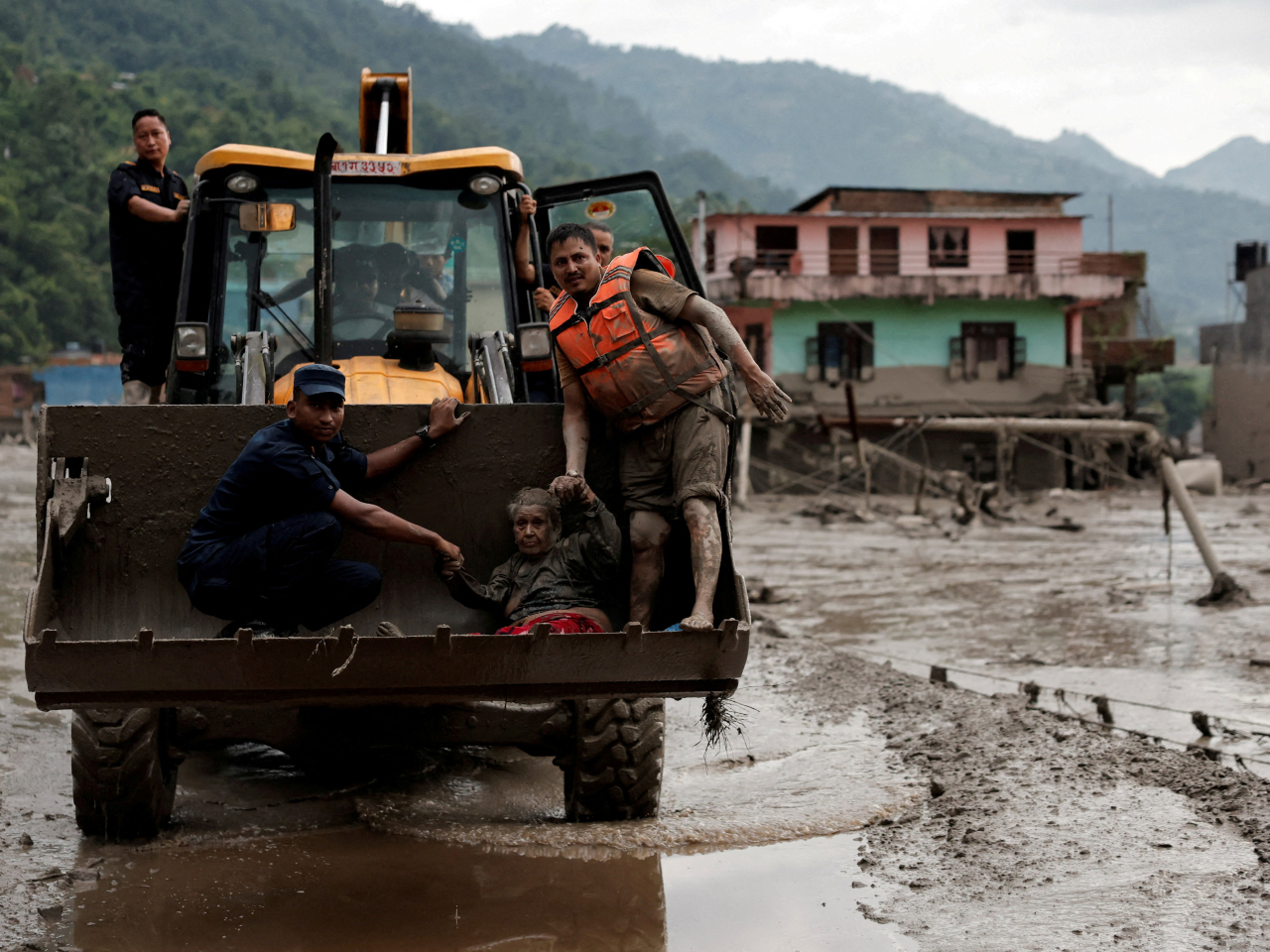 A survivor is taken to a safer place following a flash flood at Trishuli in Nuwakot district, Nepal which, like China, was also hit by the massive flood and mudslide disaster. Photo: Reuters