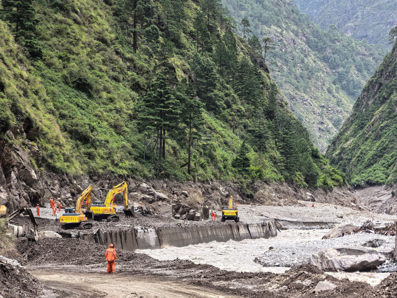 Search and rescue operations are still underway in the debris-strewn valleys and hillsides. Photo: Reuters