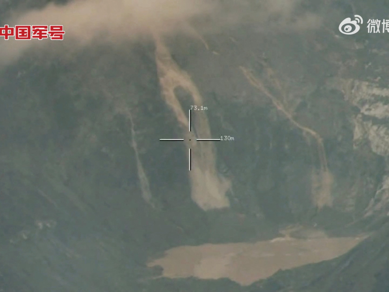 Water and mud flows into a lake at the site of the glacial collapse. Photo: PLA Media Center/Handout via Reuters
