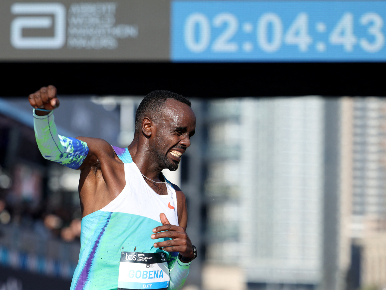 Ethiopia's Addisu Gobena celebrates as he crosses the finish line. Photo: Reuters