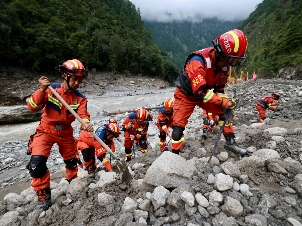 Rescue workers clear debris during search operations near Gyirong Port. Photo: China Daily via Reuters