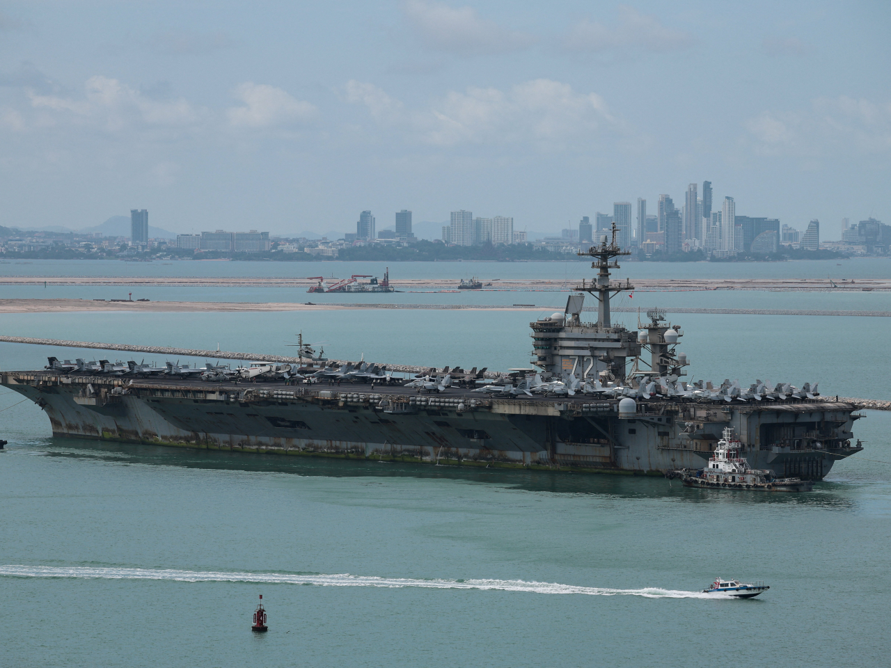 The USS Abraham Lincoln sails toward Laem Chabang Port before docking for a rest stop following a long deployment in the Middle East. Photo: Reuters