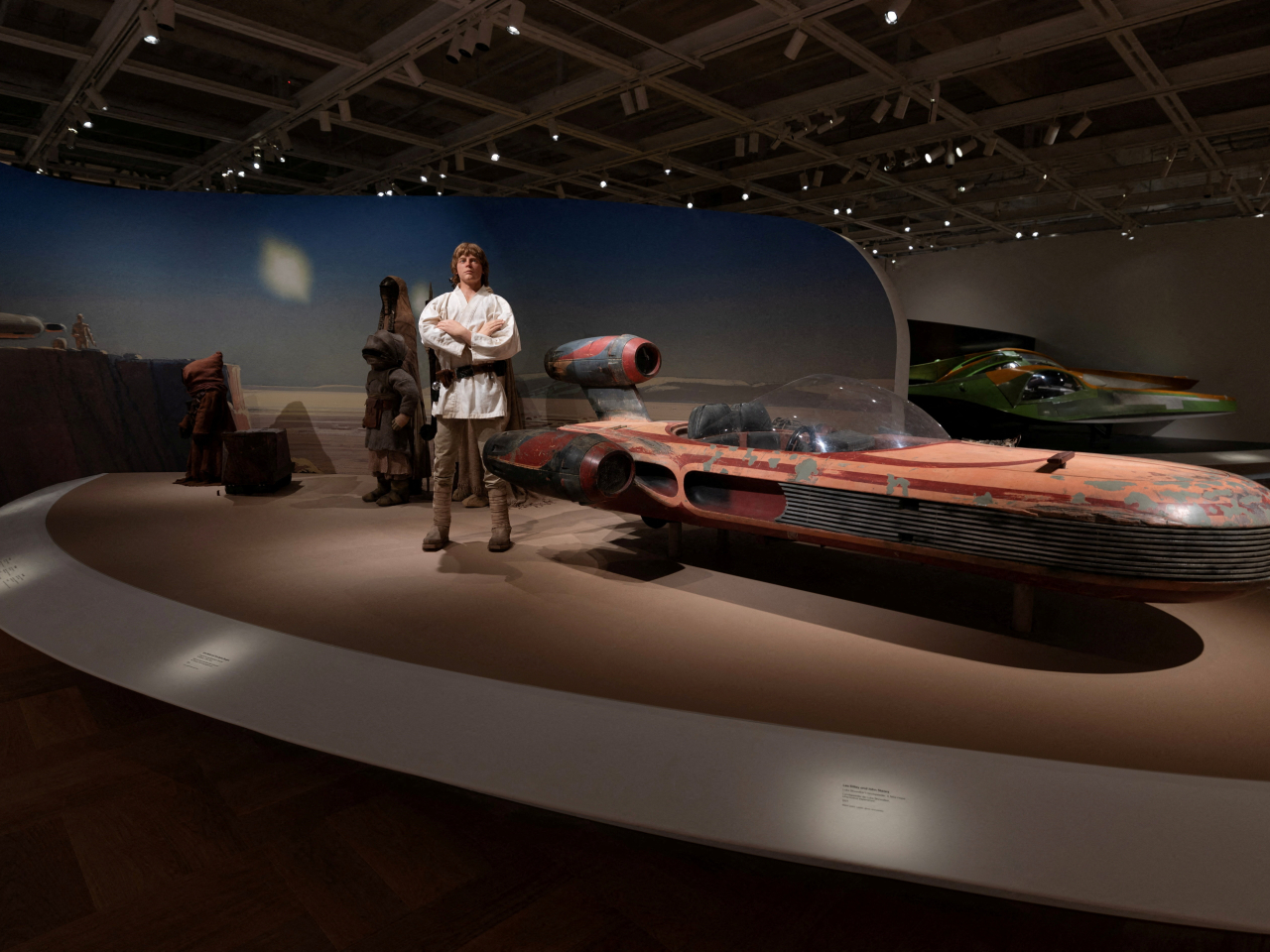 Luke Skywalker and his Landspeeder take pride of place in one display from the Star Wars' galaxy. Photo: Reuters
