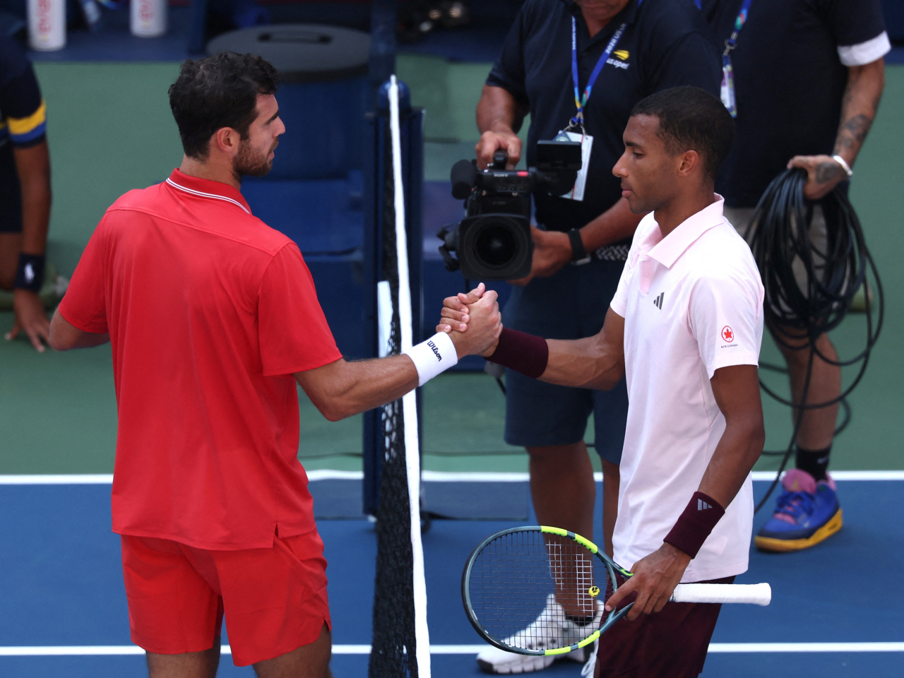 World number 50 Khachanov, left, ousted third seed Auger-Aliassime in four sets. Photo: Reuters