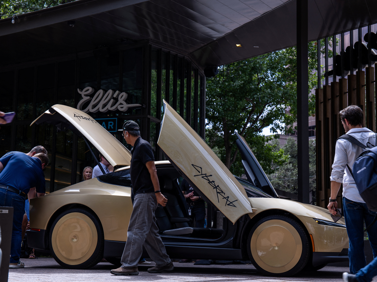 People get a load of one of the Cybercabs at the launch venue in Austin. Photo: Reuters
