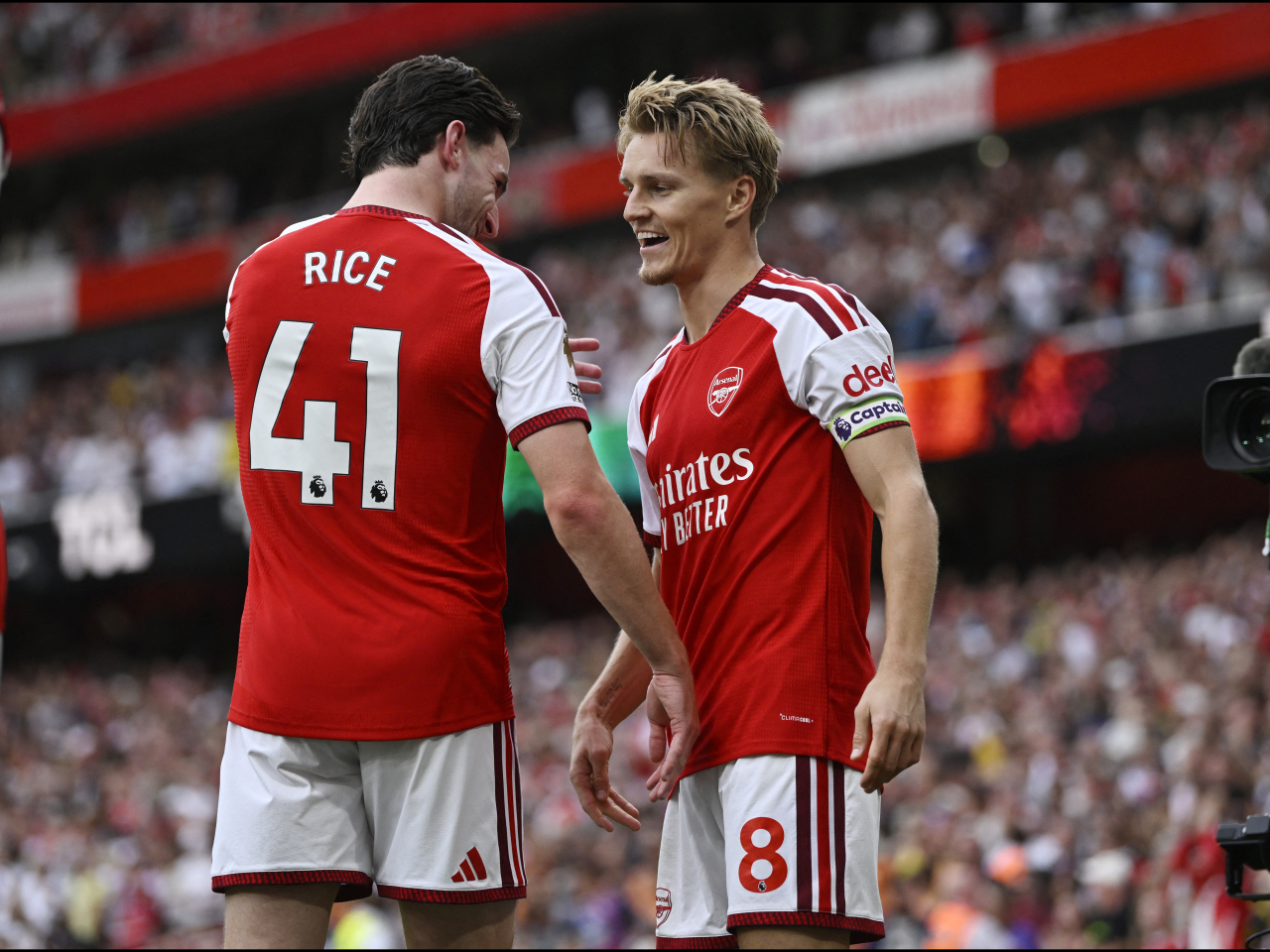 Arsenal's Martin Odegaard celebrates scoring their second goal with Declan Rice. Photo: Reuters