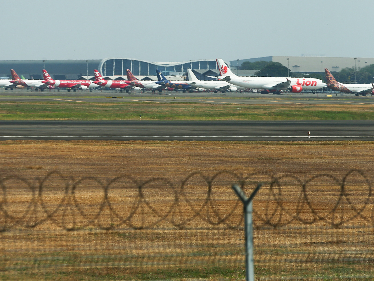 Airplanes are parked as Soekarno Hatta International Airport in Jakarta closed its operations due to the eruption of the Mount Anak Krakatau volcano. Photo: Reuters