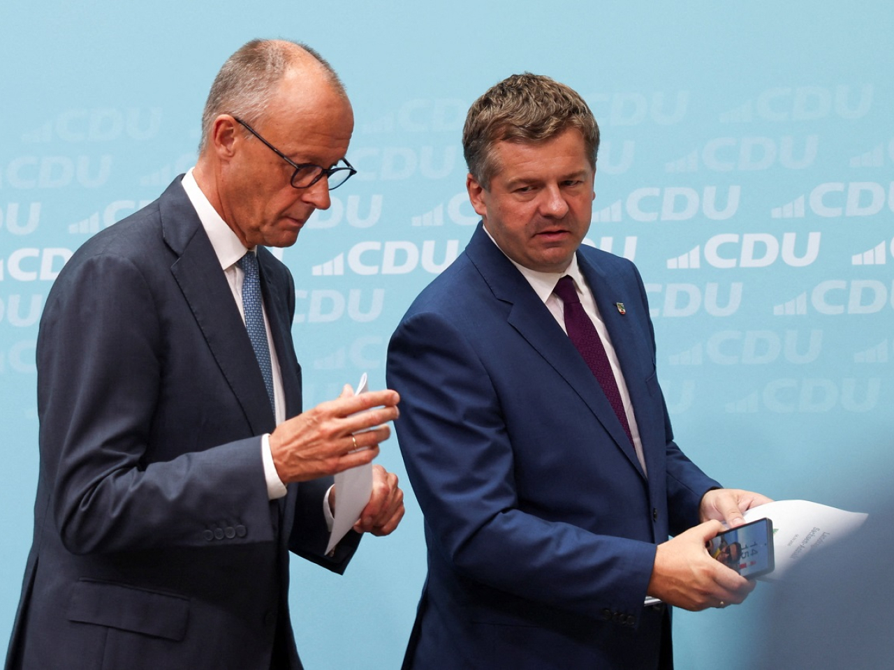 German Chancellor Friedrich Merz, left, and Saxony-Anhalt State Premier Sven Schulze of the CDU are on damage control mode a day after the election loss. Photo: Reuters
