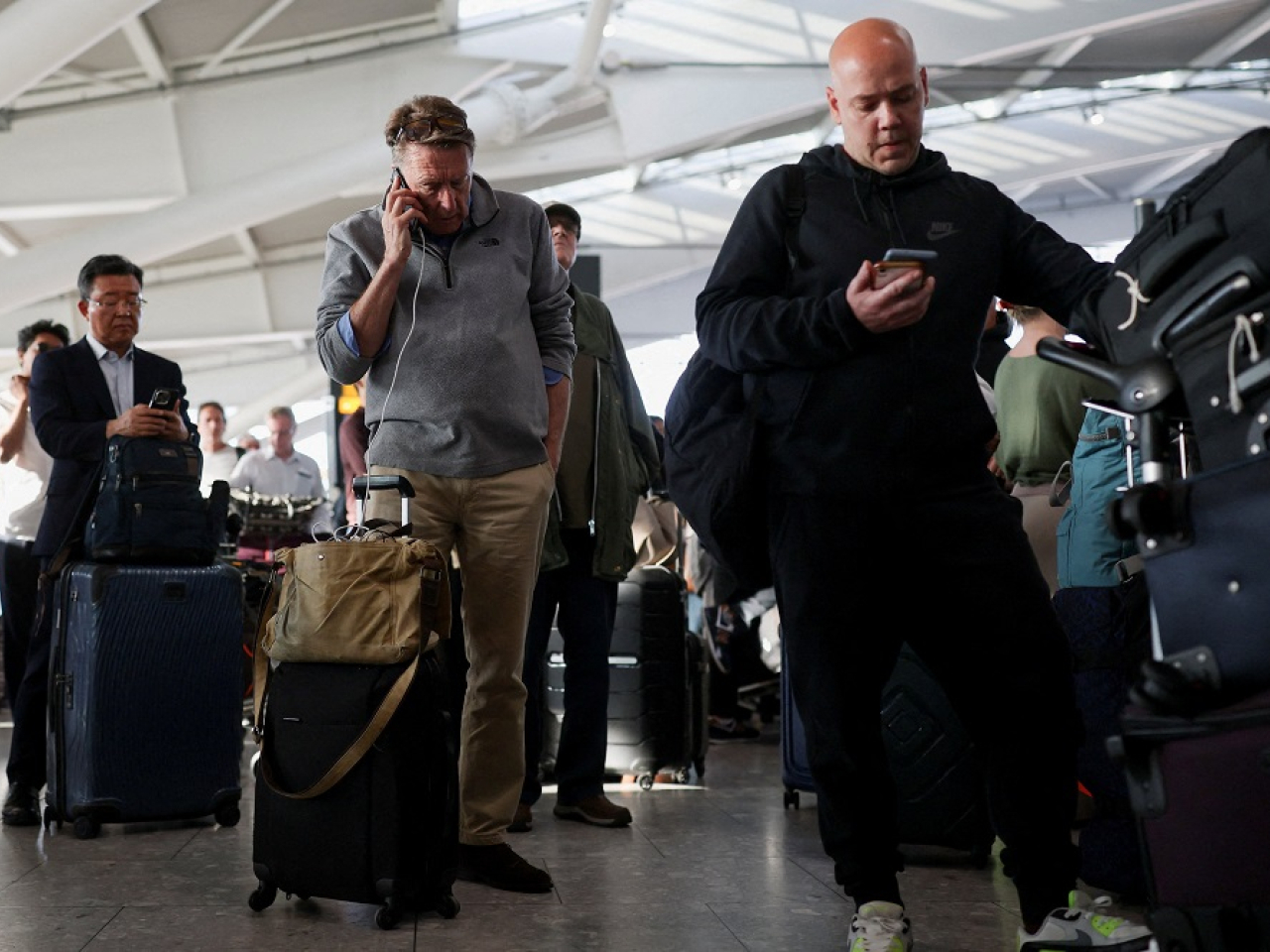 Frustrated travellers wait at Heathrow, Britain's largest and busiest airport, in west London. Photo: Reuters
